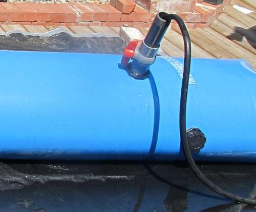 Fill port with attached ball valve and extension pipe. Fill ports are offset to allow for barrier stacking.